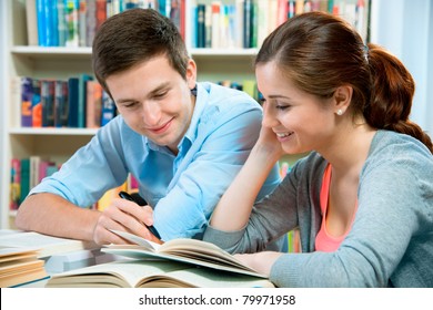 Couple Of Students In A Library