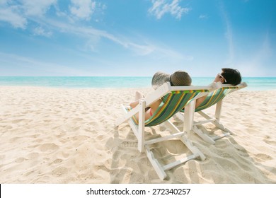 https://image.shutterstock.com/image-photo/couple-sunbathing-on-beach-chair-260nw-272340257.jpg