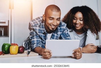 Couple, tablet and cooking food in kitchen at home with blog, internet website and online connection. Happy African man, woman and digital recipe for reading instruction of healthy vegetarian meal - Powered by Shutterstock