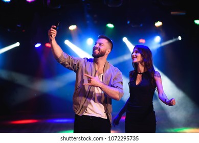 Couple Take A Selfie With A Mobile In The Night Celebration