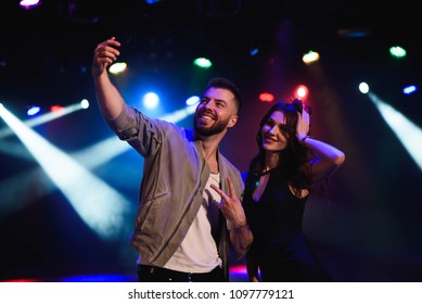 Couple Take A Selfie With A Mobile In The Night Celebration