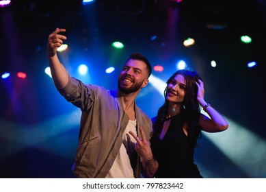 Couple Take A Selfie With A Mobile In The Night Celebration