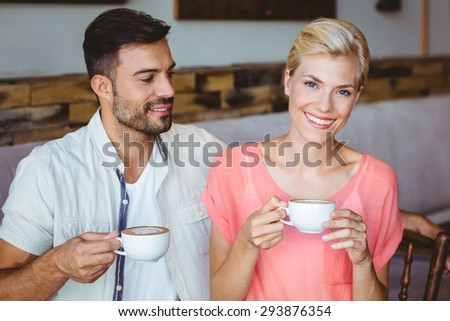 Couple taking a cup of coffee at the cafe
