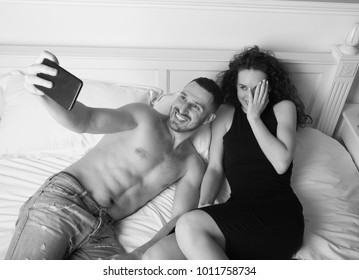 Couple Taking Selfie. Happy Couple Doing Photo. Woman In Black Dress. Couple In Bed. Man Is Embarrassed. Funny Faces 