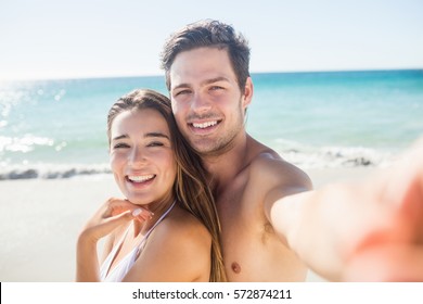 Couple Taking A Selfie On The Beach