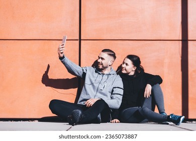 Couple taking selfie photo after workout in ubran city area. Active lifestyle