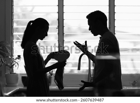 Couple talking in the kitchen, relationship problem solving 