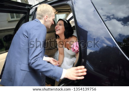 couple talking near wedding limo.holidays and events