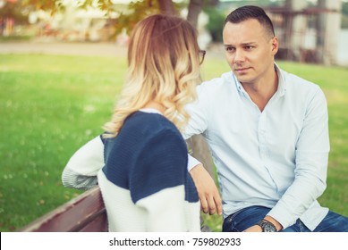 Couple talking outdoors in a park