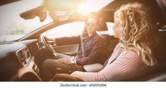 Couple Talking While Sitting In Car During Test Drive