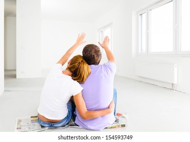 Couple At Their New Empty Apartment