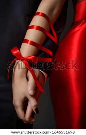 Couple Tied Hands, Woman and Man Arms Bonded Together by Red Ribbon, Relationship Concept
