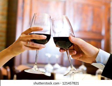 Couple toasting wine glasses - Powered by Shutterstock
