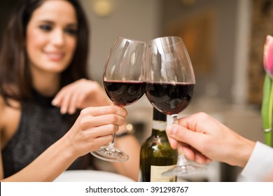 Couple Toasting Wineglasses In A Luxury Restaurant