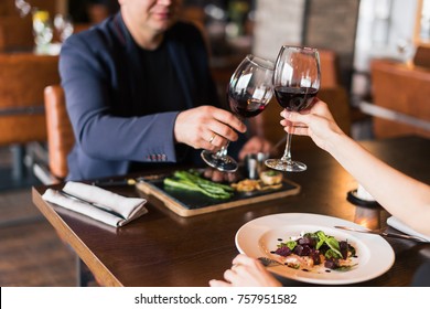 Couple toasting wineglasses in a luxury restaurant - Powered by Shutterstock