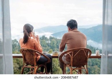 Couple tourist drinking coffee and eating breakfast against mountain view at countryside home or homestay in the morning. Vacation, together travel, honeymoon, blogger, journey and trip concept - Powered by Shutterstock