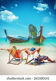 Couple Of Tourists On The Beach In Thailand