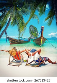 Couple Of Tourists On The Beach In Thailand