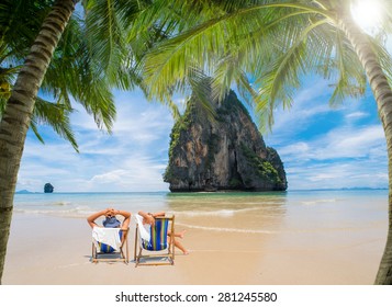 Couple Of Tourists On The Beach In Thailand