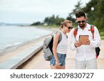 Couple of tourists using tablet pc