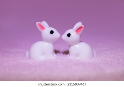 Couple Of Toy White Rabbits Kissing. Romantic And Cute St. Valentine's Day Postcard