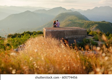 Couple Travel Mountains And Sea View. Picturesque Landscape. Travelling Europe At Honeymoon. Mountains And Sea View At Sunset.