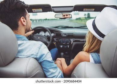 Couple Traveling On The Cabriolet. Back View. Close-up.