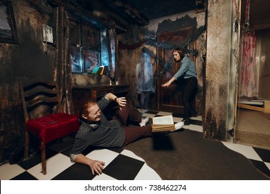 Couple trying to escape from burnt room with a ghost girl - Powered by Shutterstock