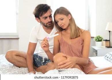 Couple trying to have a baby. Having problems in bedroom concept. Negative pregnancy test result - Powered by Shutterstock