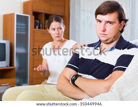 Couple trying to put things right after bad argument indoors