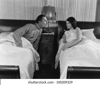 Couple In Twin Beds