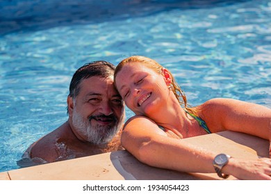 Couple Of Two Adults In Swimming Pool