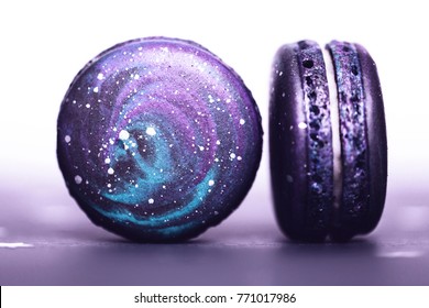 Couple of Ultra Violet macaroos with space pattern, macro. Color of the year 2018.