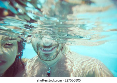 couple under water. concept about couple, vacation and fun - Powered by Shutterstock