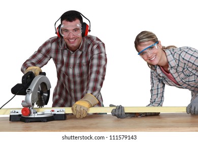 Couple using circular saw