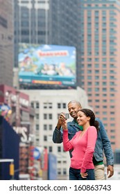 Couple Using Digital Camera