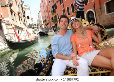 Couple in Venice having a Gondola ride on the canal