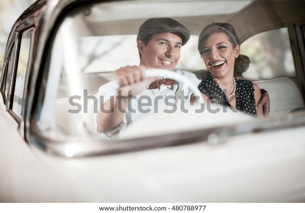 Couple in vintage\
car