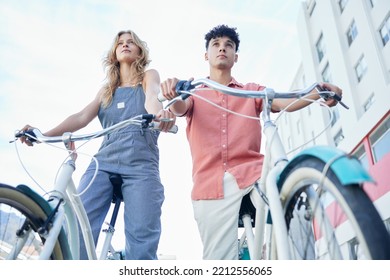 Couple, Vintage And Eco Friendly Bicycle In City For Carbon Neutral Travel Adventure Low Angle. Sustainability People In Florida On Outdoor Summer Cycle Date Focused On View In Urban Town.