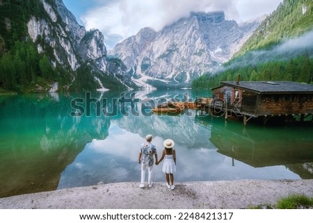 couple visit Braies Lake Lago di Braies Italian Dolomites alpine lake Italy, Europe, men, and women visit Lago Di Braies