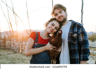 Couple Volunteering At An Animal Sanctuary