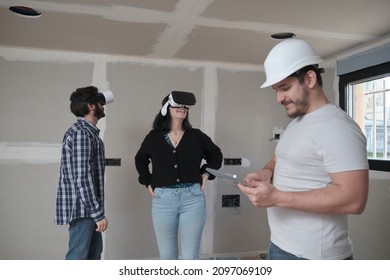 Couple With Vr Goggles Watching Virtual Project At Their New Home.