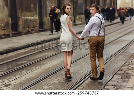 couple walk in old town lvov,kissing,loving