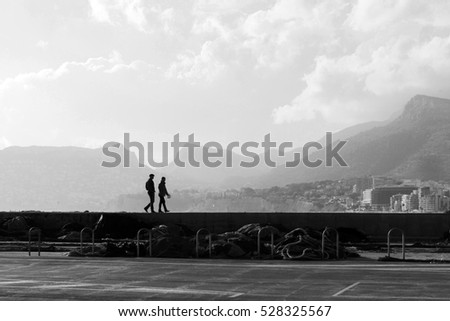 Couple walk on the boardwalk