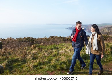 Couple Walking Along Coastal Path - Powered by Shutterstock