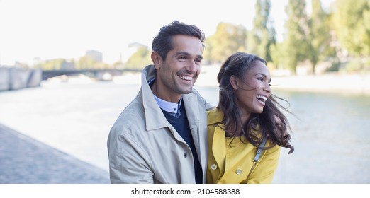 Couple Walking Along Seine River, Paris, France