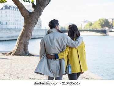 Couple Walking Along Seine River, Paris, France