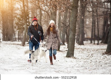Couple Walking Dog Winter
