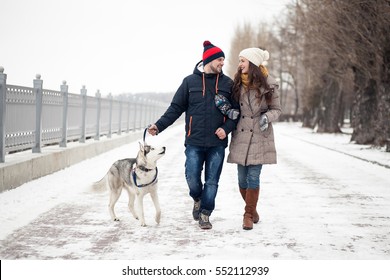 Couple Walking Dog Winter