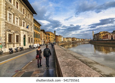 Couple Walking On A Pisa Street , Pisa , Italy 